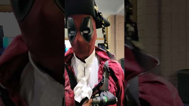 Captain Dreadpool gets photobombed by Spider-Man at Metrocon